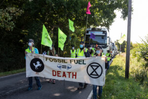 protesters with banner in front of lorry on Horse Hill